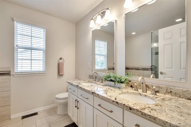 7472 S Memphis St, Aurora, CO 80016 - bathroom with double vanity, toilet, baseboards, tile patterned floors, and recessed lighting