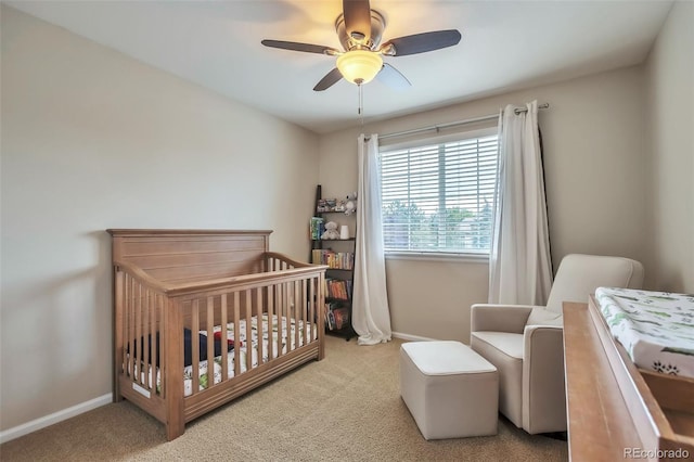 7472 S Memphis St, Aurora, CO 80016 - bedroom featuring carpet, a crib, baseboards, and ceiling fan