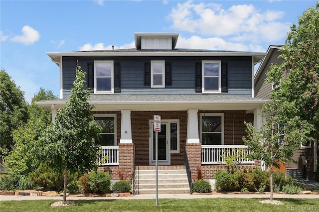 10109 E 28th Ave, Denver, CO 80238 - traditional style home with covered porch, brick siding, and a shingled roof