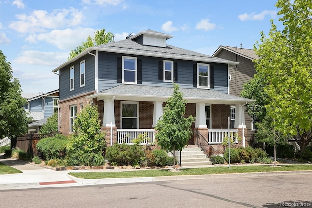 10109 E 28th Ave, Denver, CO 80238 - traditional style home featuring covered porch, a shingled roof, and brick siding