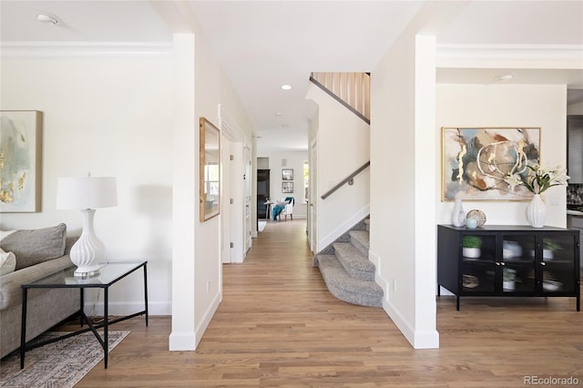 10109 E 28th Ave, Denver, CO 80238 - hallway with stairway, wood finished floors, baseboards, ornamental molding, and recessed lighting