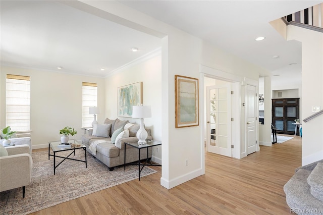 10109 E 28th Ave, Denver, CO 80238 - living room featuring baseboards, ornamental molding, light wood-style flooring, and recessed lighting