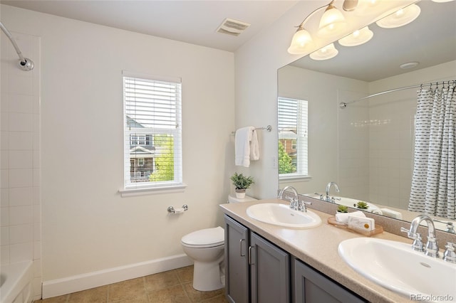 10109 E 28th Ave, Denver, CO 80238 - full bath featuring toilet, baseboards, tile patterned flooring, double vanity, and shower / bath combo with shower curtain