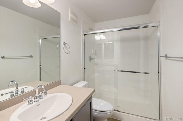 10109 E 28th Ave, Denver, CO 80238 - bathroom featuring toilet, a shower stall, and vanity