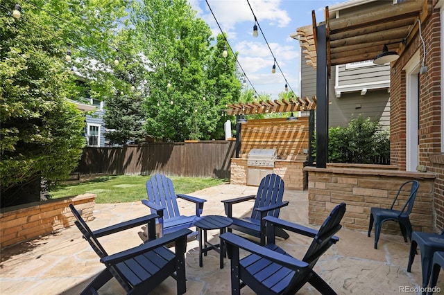 10109 E 28th Ave, Denver, CO 80238 - view of patio / terrace with exterior kitchen, fence, a pergola, and area for grilling