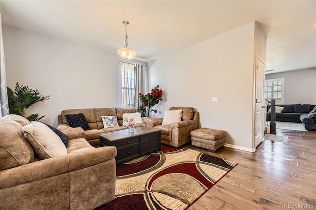 7360 S Old Hammer Way, Aurora, CO 80016 - living area featuring hardwood / wood-style flooring and baseboards