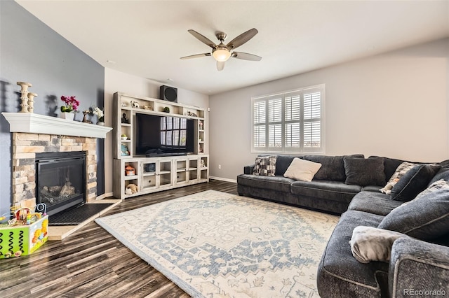 7360 S Old Hammer Way, Aurora, CO 80016 - living room with a ceiling fan, dark wood finished floors, and a fireplace