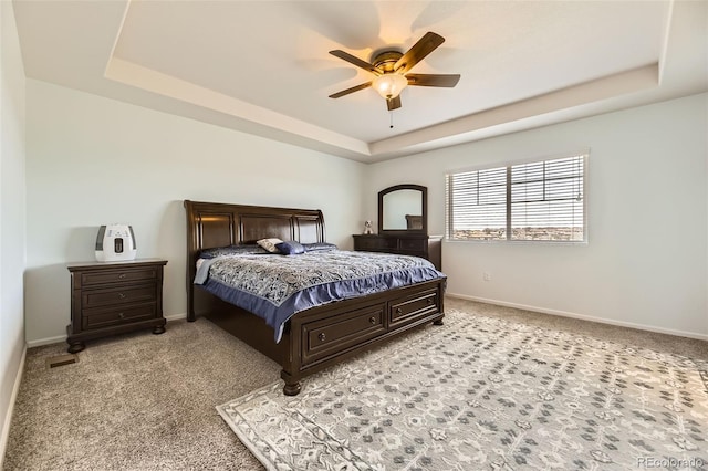 7360 S Old Hammer Way, Aurora, CO 80016 - bedroom featuring a raised ceiling, light colored carpet, and a ceiling fan