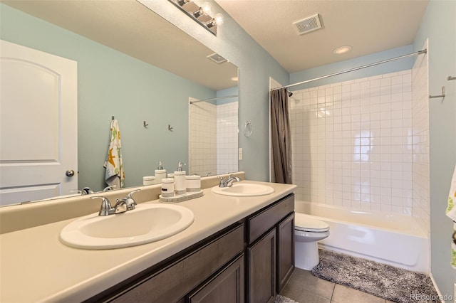 7360 S Old Hammer Way, Aurora, CO 80016 - bathroom featuring shower / tub combo, double vanity, and tile patterned flooring