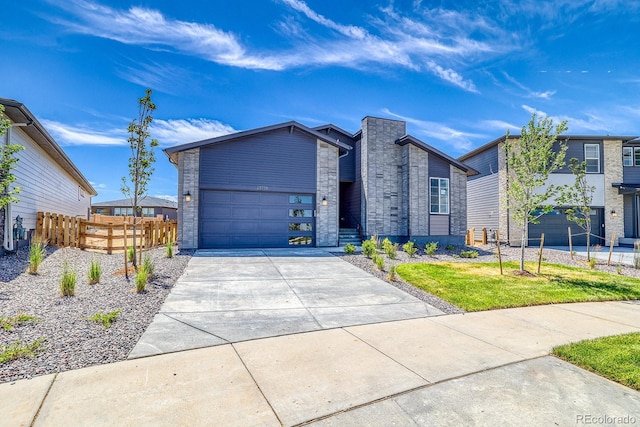 23738 E 42nd Ave, Aurora, CO 80019 - modern home with driveway and a garage