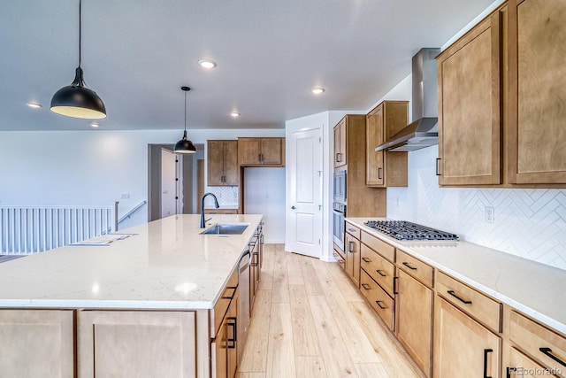 23738 E 42nd Ave, Aurora, CO 80019 - kitchen with wall chimney exhaust hood, stainless steel appliances, backsplash, light wood-style floors, and a kitchen island with sink