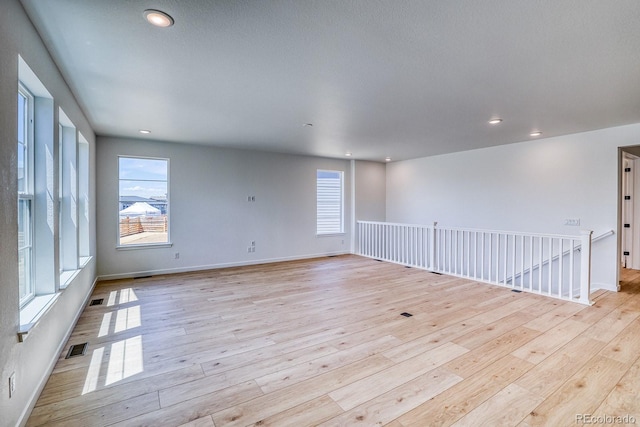 23738 E 42nd Ave, Aurora, CO 80019 - spare room featuring light wood-type flooring, healthy amount of natural light, and recessed lighting