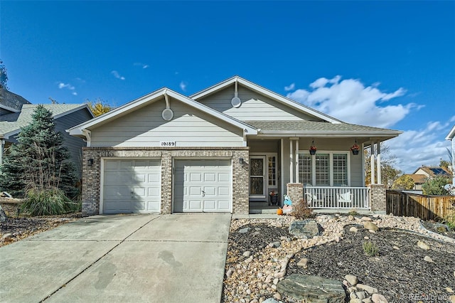 craftsman house featuring covered porch and a garage