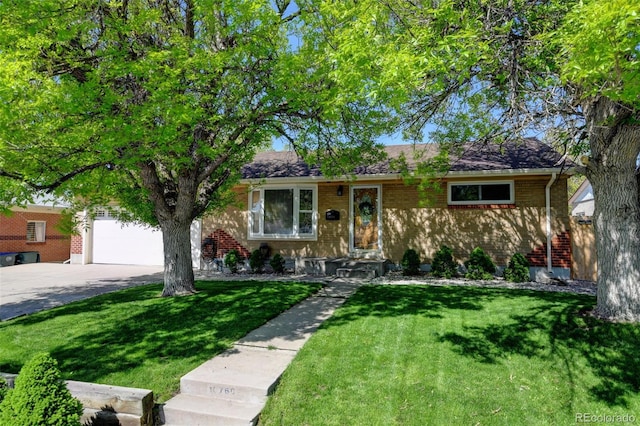 10769 Carrol Ln, Northglenn, CO 80233 - ranch-style house with driveway, a front yard, a garage, and brick siding