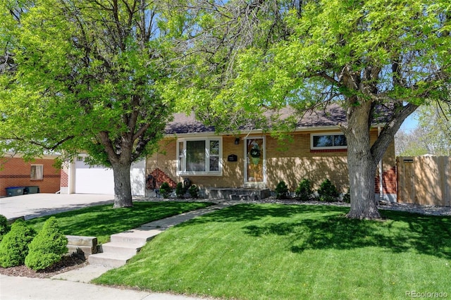 10769 Carrol Ln, Northglenn, CO 80233 - view of front of house with driveway, brick siding, and an attached garage