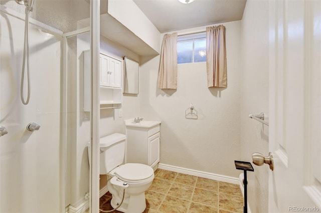 10769 Carrol Ln, Northglenn, CO 80233 - bathroom featuring a shower stall, toilet, vanity, and baseboards