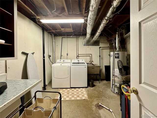 10769 Carrol Ln, Northglenn, CO 80233 - unfinished below grade area with gas water heater, washer and dryer, and a sink