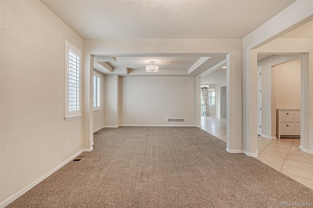 10272 Greenfield Cir, Parker, CO 80134 - unfurnished room featuring light colored carpet, baseboards, a raised ceiling, and light tile patterned flooring
