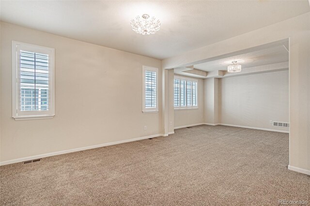 10272 Greenfield Cir, Parker, CO 80134 - carpeted empty room with a chandelier and baseboards