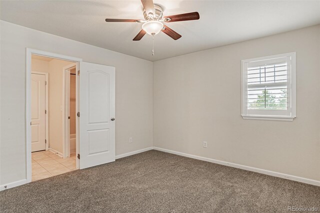 10272 Greenfield Cir, Parker, CO 80134 - spare room with light colored carpet, ceiling fan, and baseboards