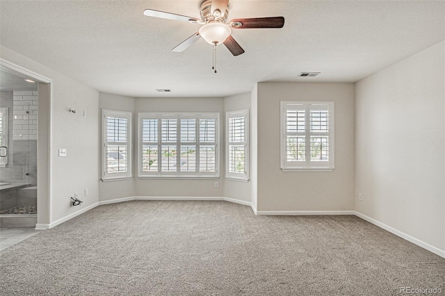 10272 Greenfield Cir, Parker, CO 80134 - carpeted spare room featuring baseboards, a ceiling fan, and a textured ceiling