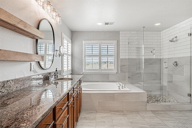 10272 Greenfield Cir, Parker, CO 80134 - bathroom with double vanity, a bath, a stall shower, and recessed lighting