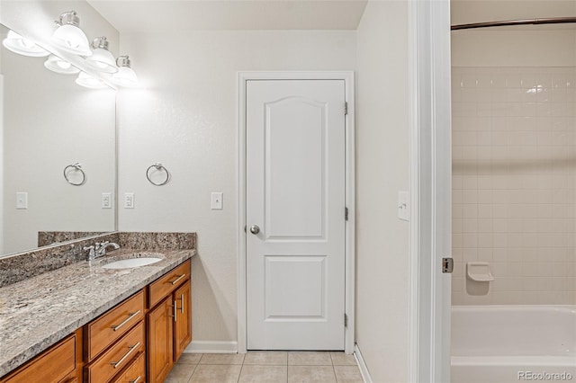 10272 Greenfield Cir, Parker, CO 80134 - bathroom featuring tile patterned flooring, vanity, baseboards, and bathing tub / shower combination