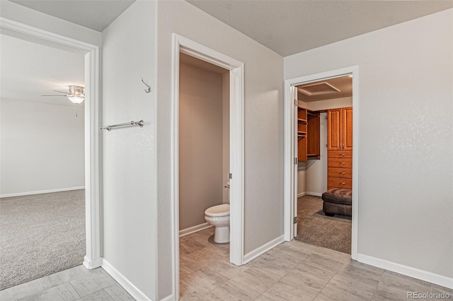 10272 Greenfield Cir, Parker, CO 80134 - bathroom featuring toilet, ceiling fan, and baseboards