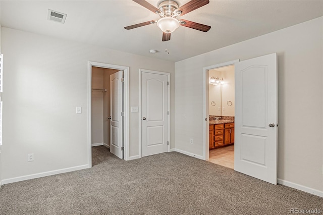 10272 Greenfield Cir, Parker, CO 80134 - unfurnished bedroom featuring light colored carpet, a spacious closet, and baseboards