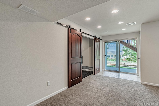 10272 Greenfield Cir, Parker, CO 80134 - unfurnished bedroom featuring access to outside, a barn door, light carpet, recessed lighting, and baseboards