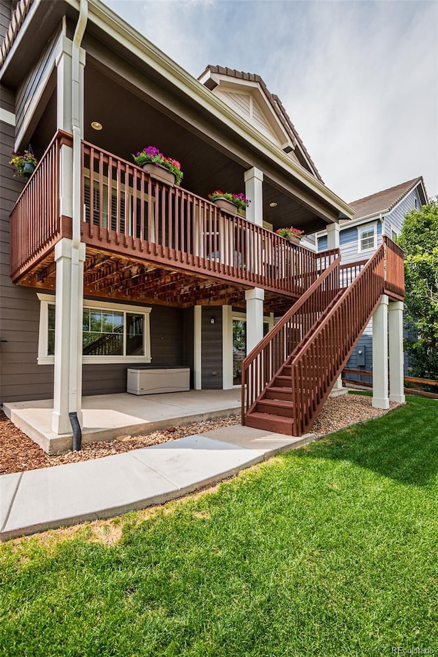 10272 Greenfield Cir, Parker, CO 80134 - rear view of property featuring a patio, a yard, a deck, and stairway