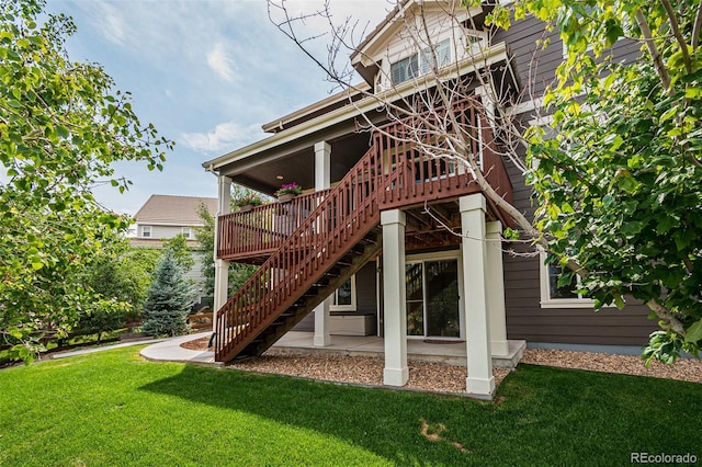 10272 Greenfield Cir, Parker, CO 80134 - back of house with stairway, a yard, a deck, and a patio