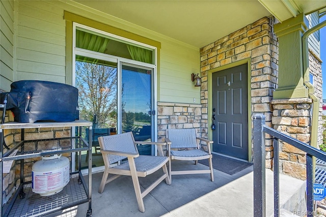 property entrance featuring stone siding
