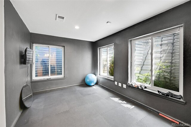 exercise room with baseboards