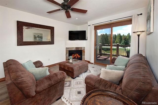 34 Highfield Trl Unit 311, Breckenridge, CO 80424 - living area featuring ceiling fan, baseboards, a tiled fireplace, and wood finished floors