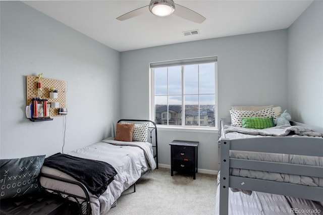 bedroom featuring baseboards, visible vents, ceiling fan, and carpet