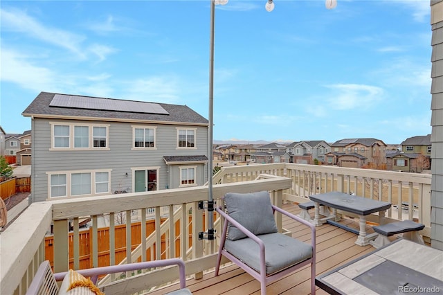 wooden deck featuring a residential view