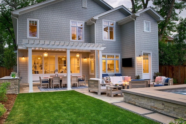 2130 S Milwaukee St, Denver, CO 80210 - back of house featuring a patio area, a lawn, outdoor lounge area, and fence
