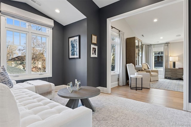 2130 S Milwaukee St, Denver, CO 80210 - living area with wood finished floors, visible vents, baseboards, recessed lighting, and vaulted ceiling