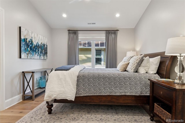 2130 S Milwaukee St, Denver, CO 80210 - bedroom with visible vents, recessed lighting, lofted ceiling, and wood finished floors