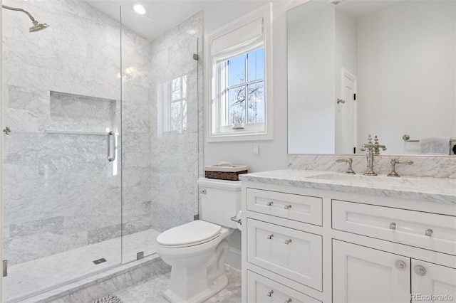 2130 S Milwaukee St, Denver, CO 80210 - bathroom with marble finish floor, a shower stall, toilet, and vanity