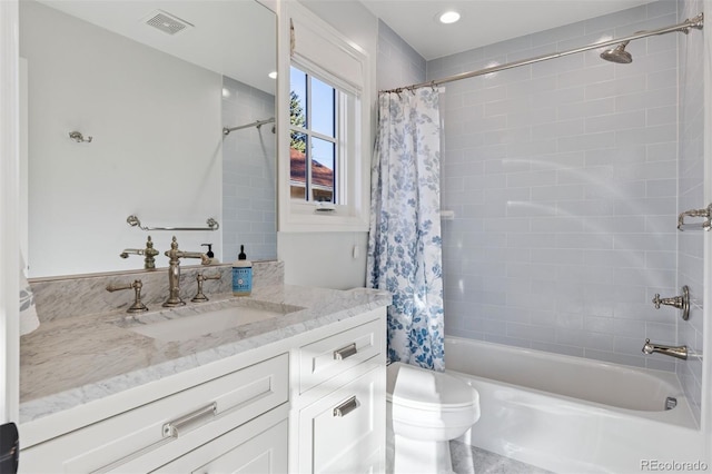 2130 S Milwaukee St, Denver, CO 80210 - bathroom with vanity, shower / bath combination with curtain, toilet, and visible vents