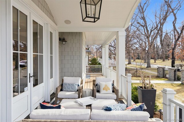 2130 S Milwaukee St, Denver, CO 80210 - view of patio featuring covered porch and fence