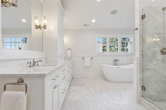 2130 S Milwaukee St, Denver, CO 80210 - full bath featuring visible vents, a wainscoted wall, a stall shower, a soaking tub, and marble finish floor