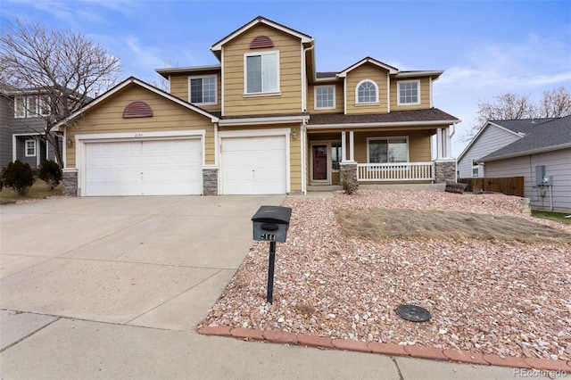 view of front of home featuring a porch and a garage