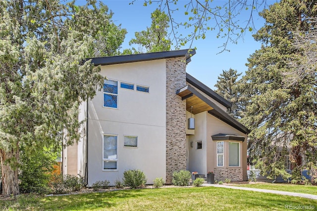 1533 S Columbine St, Denver, CO 80210 - view of front facade featuring stone siding, a front lawn, and stucco siding