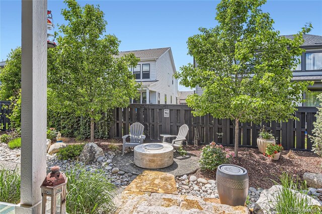 11253 Moondance Trl, Littleton, CO 80125 - view of patio / terrace with an outdoor fire pit