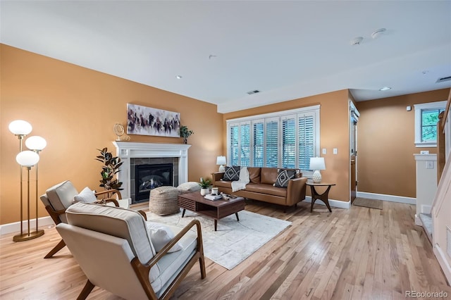 753 Pearl St, Boulder, CO 80302 - living area featuring light wood-style flooring, a fireplace, and baseboards