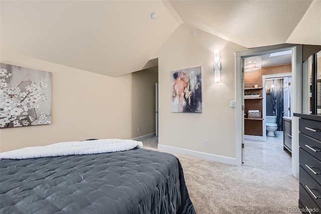 753 Pearl St, Boulder, CO 80302 - bedroom with lofted ceiling, light colored carpet, baseboards, and connected bathroom