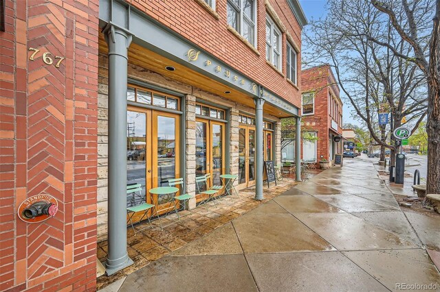 753 Pearl St, Boulder, CO 80302 - view of exterior entry with french doors and brick siding
